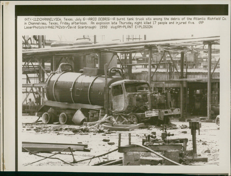 a burn tank truck sits among the debris of the atlantic richfield. - Vintage Photograph