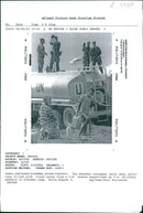 The Rwandan War:Two Rwandan refugees carry away jerry cans filled with clean water. - Vintage Photograph