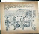 Rwanda war:soldier from the rwandan army check refugees leaving. - Vintage Photograph
