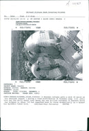 Rwanda war:rwandan refugees puts a sack of maize. - Vintage Photograph