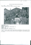 Rwanda war:rwandan refugees gather outside the american encampment. - Vintage Photograph