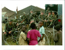 Rwanda war:rwandan refugees gather outside the american encampment. - Vintage Photograph