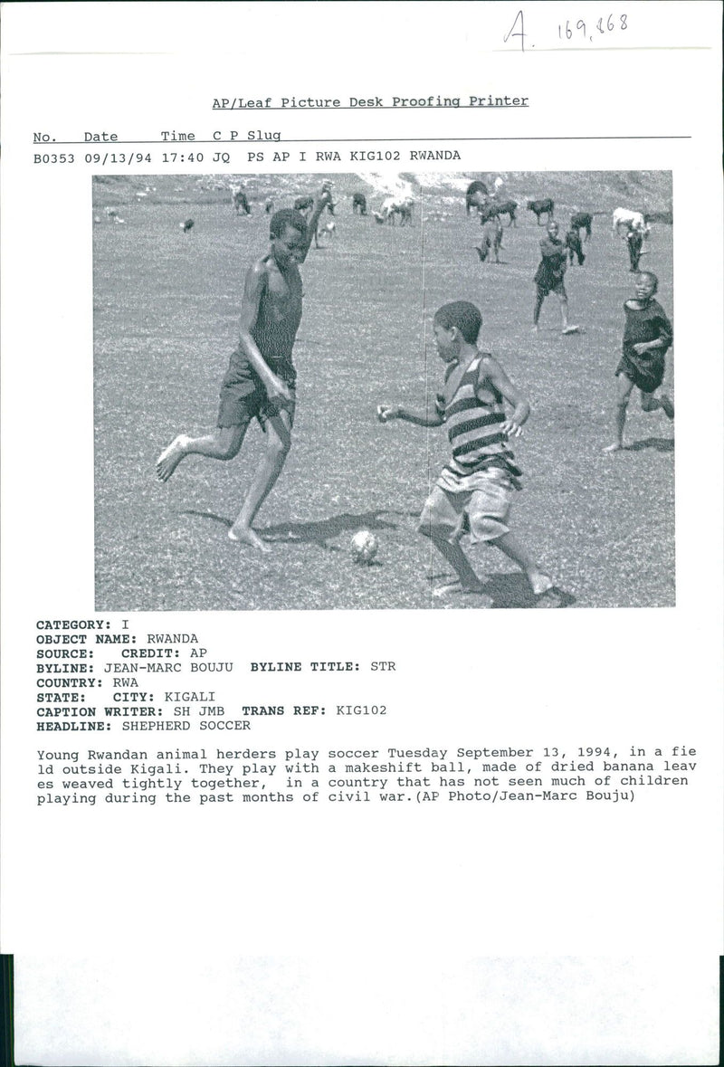 rwanda war.young rwandan animal herders play soccer - Vintage Photograph