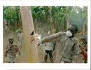 A Rwandan Hutu boy wearing a mask against the threat of disease. - Vintage Photograph