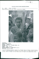 A militia Rwandan holding a spear at a refugee camp. - Vintage Photograph