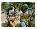 Shelling casualties are taken from a Red Cross vehicle to a hospital. - Vintage Photograph