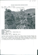 A Zairan soldier attempts to push back a crowd of panic-stricken Rwandan refugee. - Vintage Photograph