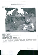 Rwanda war:a french soldier treats a boy. - Vintage Photograph