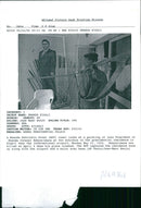 Rwanda war:rebel looks at a painting the pressident. - Vintage Photograph