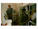 Rwanda war:rebel looks at a painting the pressident. - Vintage Photograph