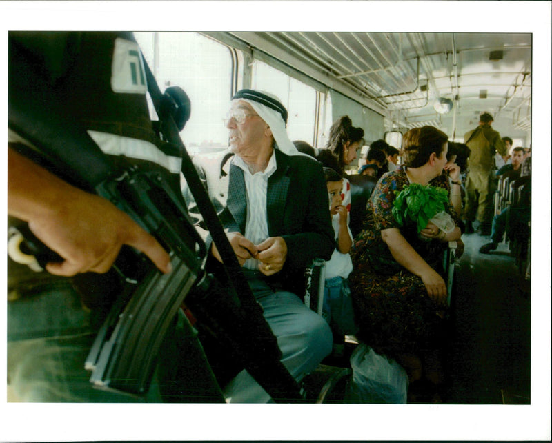 Israeli police checks I.D. cards on a Palestinian bus - Vintage Photograph