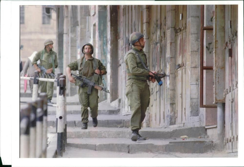 Israel hebron mosque massacre:israeli soldier patrol the streets. - Vintage Photograph