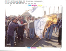 Israel hebron mosque massacre:a cairo university student hold a burning israel flag. - Vintage Photograph