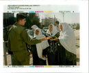 West Bank:Elderly Palestinian women with an Israeli soldier. - Vintage Photograph