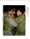 West Bank:An Israeli soldier shoves a Israeli settler. - Vintage Photograph