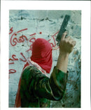 West Bank:A hooded Palestinian activist. - Vintage Photograph
