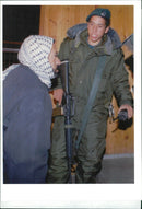 West Bank (Hebron):A Palestinian man and a Israeli soldier. - Vintage Photograph