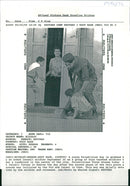 West Bank (Hebron):A young Palestinian boy is grabbed by  an armed Israeli soldier. - Vintage Photograph