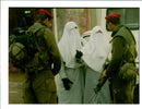 West Bank (Hebron):Two Israeli soldier checks a couple of Palestinian  women. - Vintage Photograph