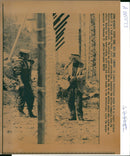 West Bank (Hebron):An elderly Palestinian speaks with an Israeli soldier. - Vintage Photograph