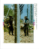 West Bank (Hebron):An elderly Palestinian speaks with an Israeli soldier. - Vintage Photograph