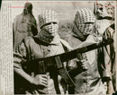 West bank palestinians with wooden rifle. - Vintage Photograph