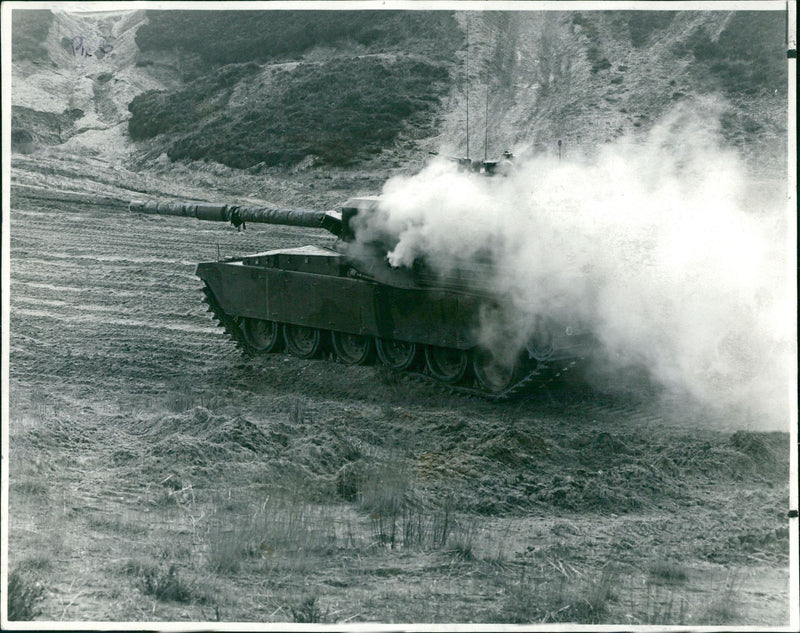 A direct hit indicated by the detonation of smoke bomb on the target tank. - Vintage Photograph