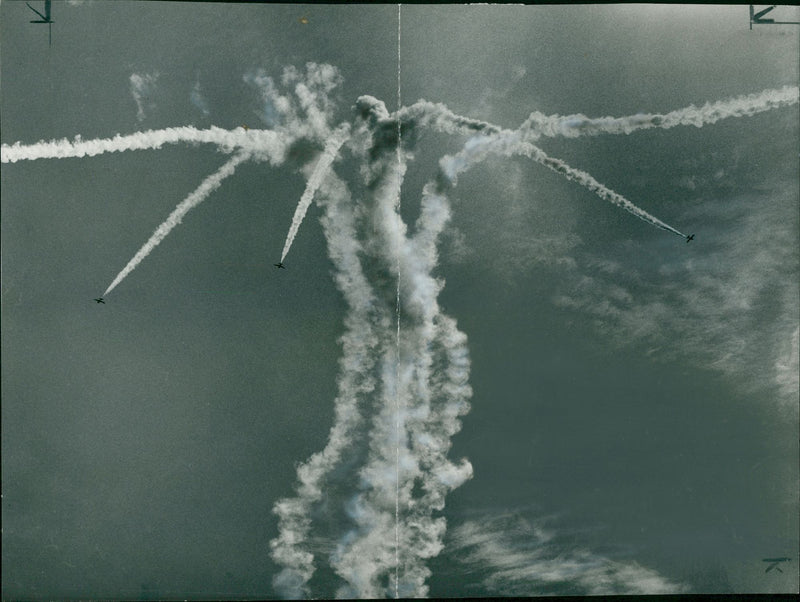 Coloured smoke streaming from provost Mk IV jets as They break away in an upward bomb. - Vintage Photograph