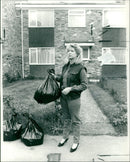 Emma Krikler re enacting yesterday the last known movements on Good friday of Shani Warren. - Vintage Photograph