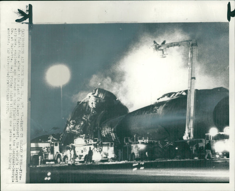 Firemen fighting a fire after a galaxy aircraft. - Vintage Photograph