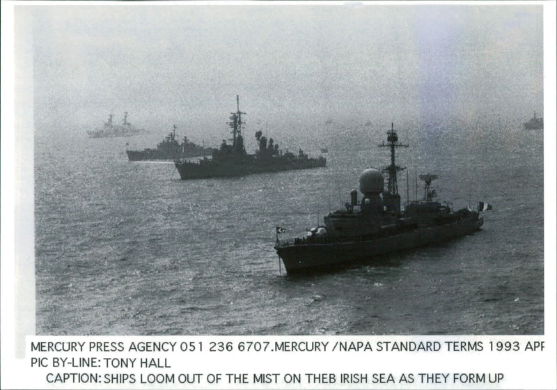 ships loom out of the mist on the irish sea. - Vintage Photograph