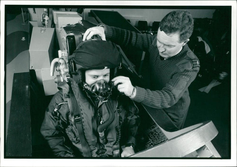 An unidentified pilot with an assistant. - Vintage Photograph