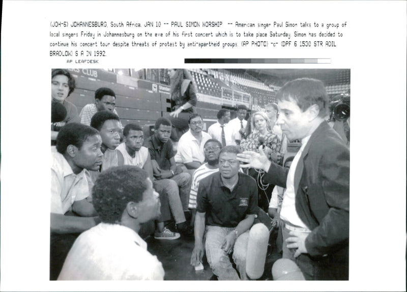 Paul Simon with a group of local singer. - Vintage Photograph
