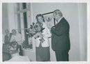 Esther Estheri handed a flower bouquet to Calle Hagman at Karl Gerhard's free concert at S.t. Eriks Hospital - Vintage Photograph