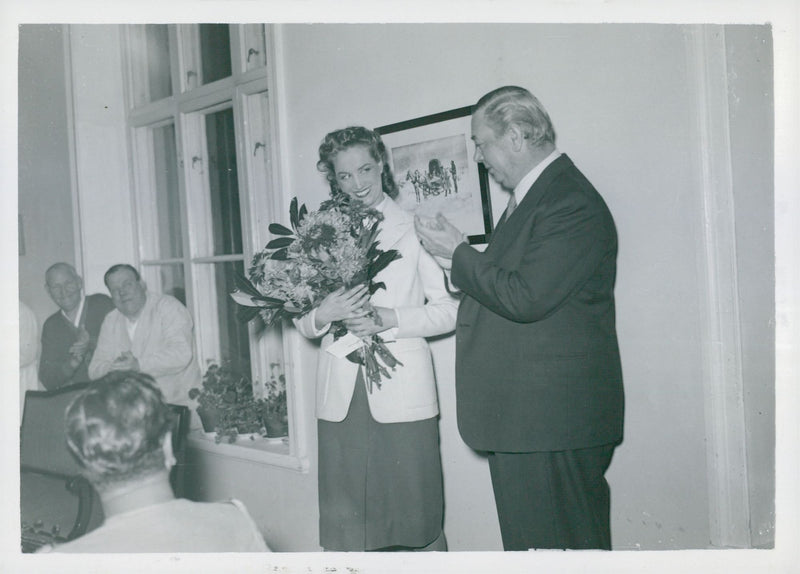 Esther Estheri handed a flower bouquet to Calle Hagman at Karl Gerhard's free concert at S.t. Eriks Hospital - Vintage Photograph
