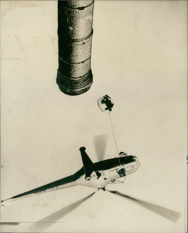 Aircraft helicopter rescue:chimney rescue by helicopter. - Vintage Photograph