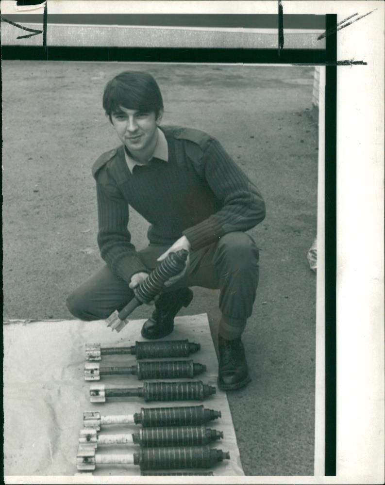 Civil rights riots 1976-1979:a soldier displaying home-made montair bombs. - Vintage Photograph