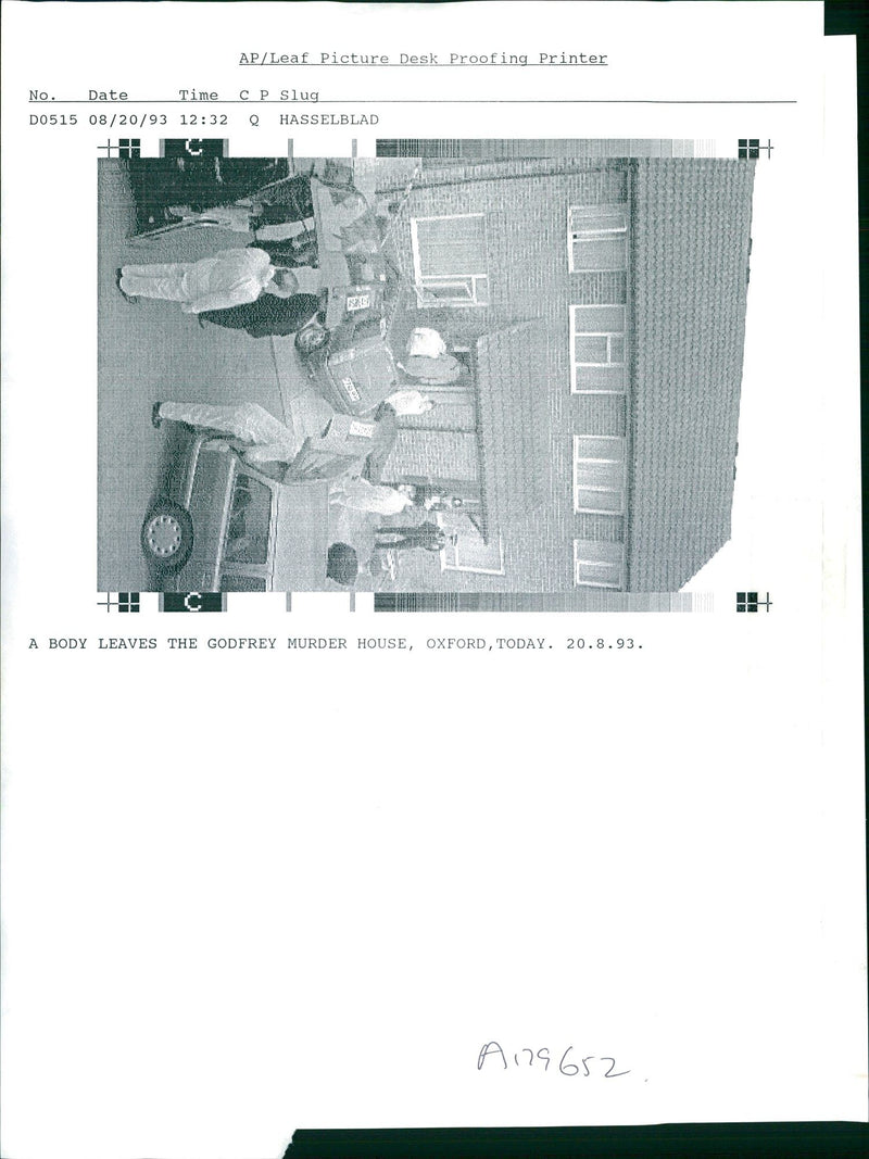 A body leaves the Godfrey Murder House. - Vintage Photograph