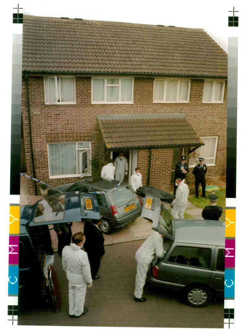 A body leaves the Godfrey Murder House. - Vintage Photograph