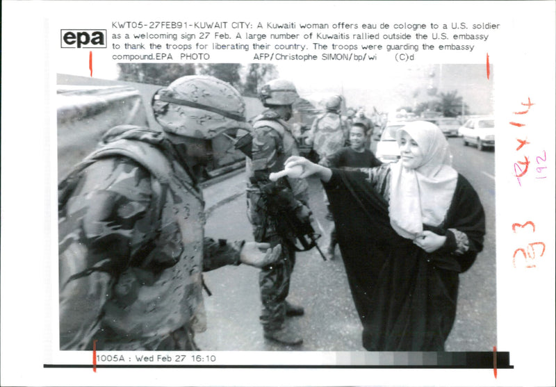 Gulf War:A Kuwaiti woman offers some eau de cologne. - Vintage Photograph