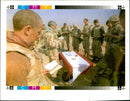 Gulf War: Padre Stephen Blakey with the members of the 4th armoured Brigade. - Vintage Photograph