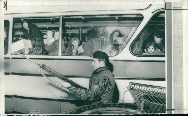 civil righh riots:a soldier guarding wives and children. - Vintage Photograph