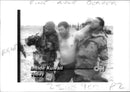 Gulf War: A man Assisted by two saudi soldiers. - Vintage Photograph