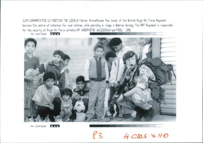 Gulf War:Children break off from a game of football. - Vintage Photograph