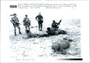 Iraq war pow:iraq soldeirs lie on the guards. - Vintage Photograph