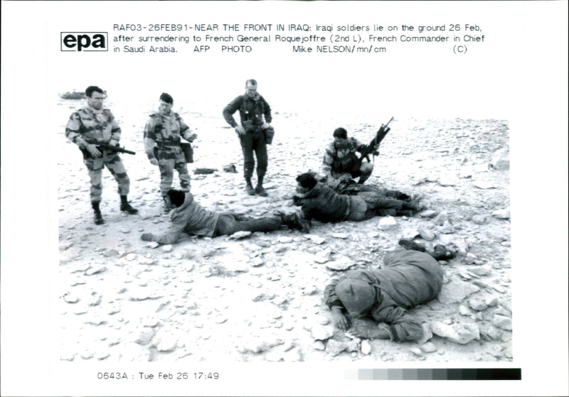 Iraq war pow:iraq soldeirs lie on the guards. - Vintage Photograph