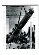 An unidentified weapon and some unidentified persons. - Vintage Photograph