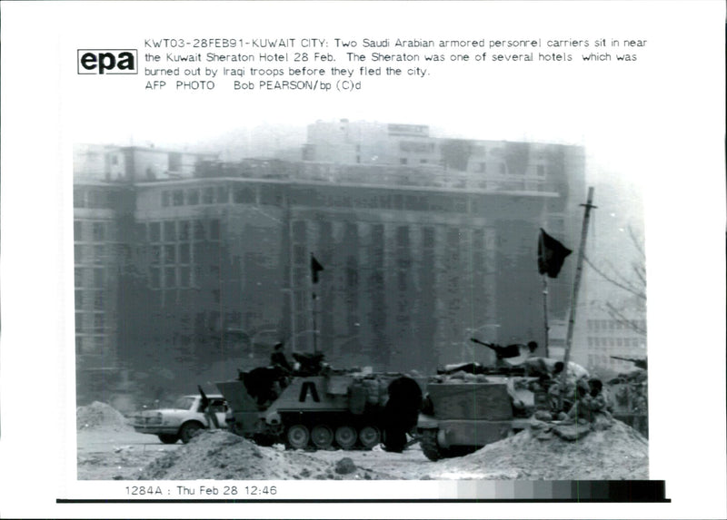 Iraq -un war kuwait city war damage:two arabian armoured personne; carries sit in near. - Vintage Photograph