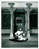 Musical instrument:nishat khan at the museum. - Vintage Photograph