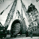 city pages 1973:positioning a floatation tank Y member. - Vintage Photograph